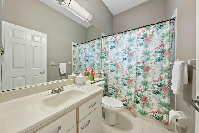 bathroom with vanity, tile patterned floors, toilet, and a shower with shower curtain