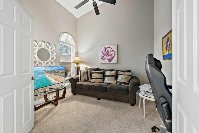 living room featuring carpet, ceiling fan, and high vaulted ceiling