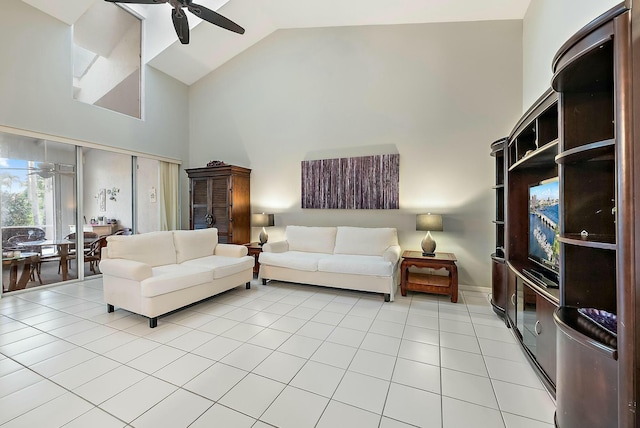 living room featuring light tile patterned floors, high vaulted ceiling, and ceiling fan