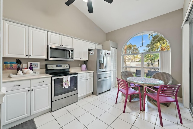 kitchen featuring white cabinets, appliances with stainless steel finishes, and light countertops