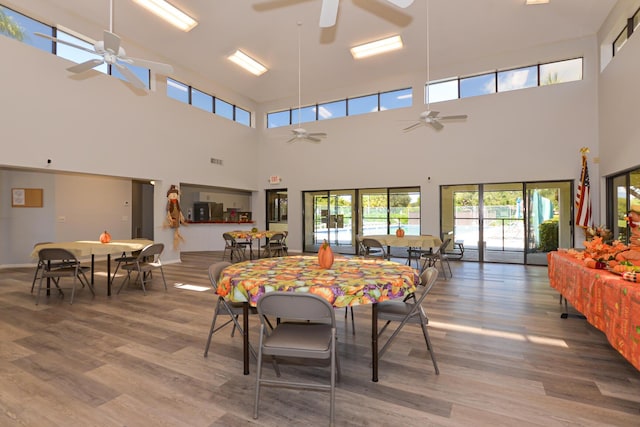 dining space featuring wood finished floors, visible vents, and ceiling fan