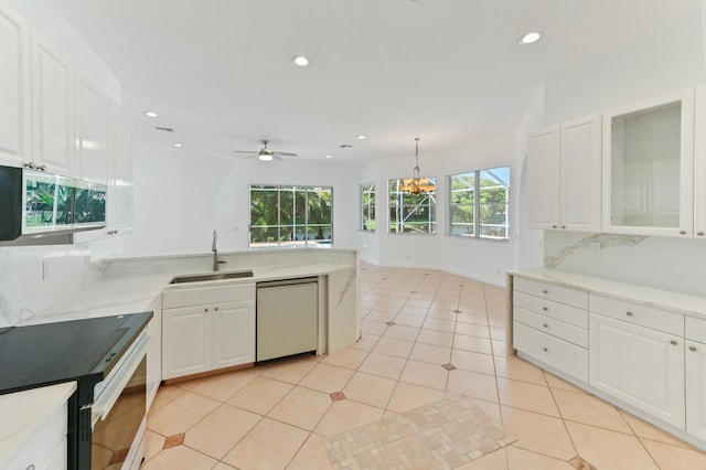 kitchen with recessed lighting, a sink, white cabinets, electric stove, and dishwasher