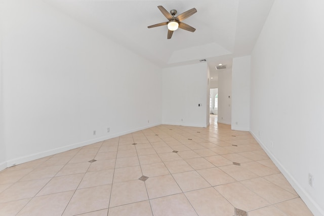 empty room with light tile patterned floors, visible vents, baseboards, and ceiling fan