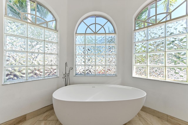 full bathroom with a soaking tub