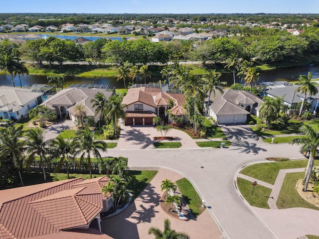 birds eye view of property with a residential view and a water view