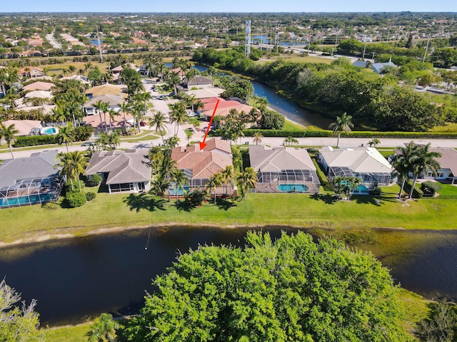 birds eye view of property featuring a water view and a residential view