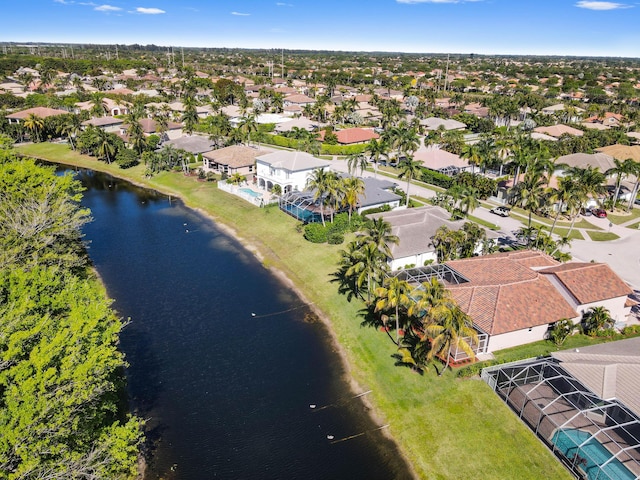 drone / aerial view with a residential view and a water view