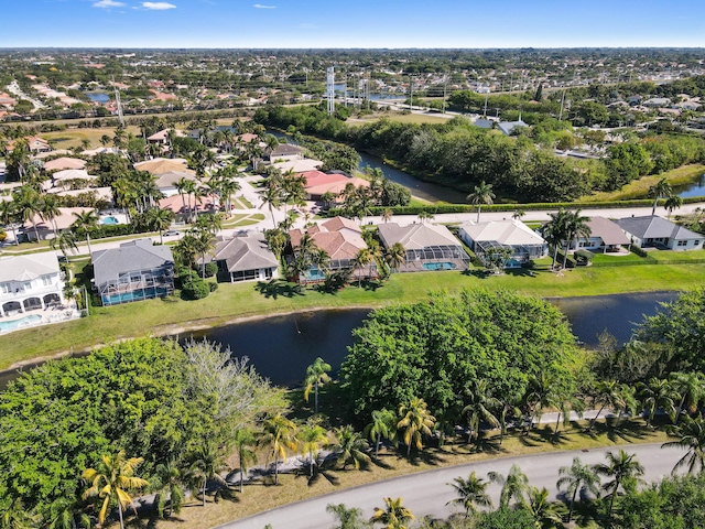 drone / aerial view featuring a residential view and a water view