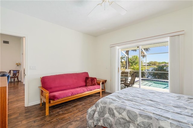 bedroom featuring visible vents, baseboards, wood finished floors, and access to outside