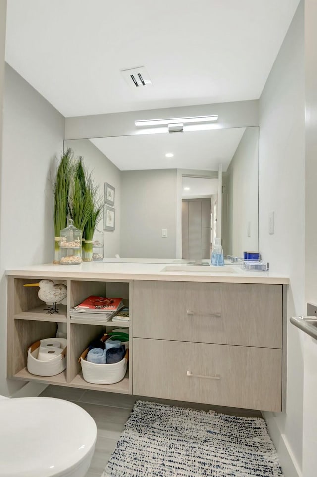 bathroom with vanity and visible vents