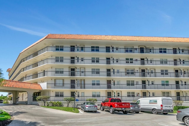 view of property featuring uncovered parking