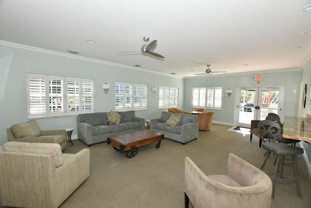 living room featuring visible vents, ornamental molding, french doors, carpet flooring, and baseboards