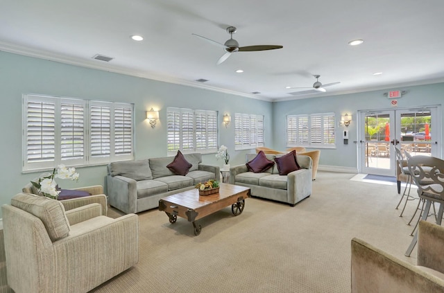 carpeted living room with visible vents, crown molding, baseboards, recessed lighting, and french doors