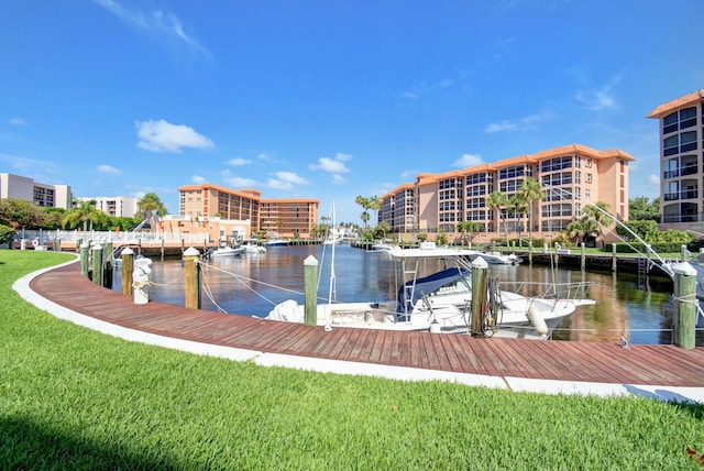 view of dock featuring a yard and a water view