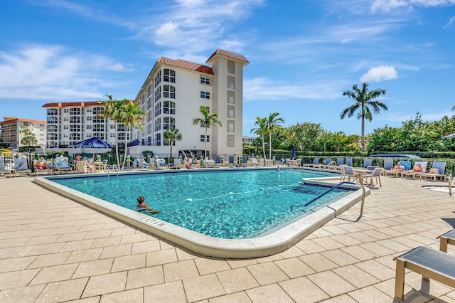 community pool with a patio area