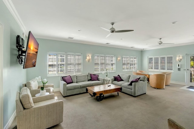 living area with baseboards, light carpet, visible vents, and crown molding