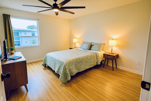 230 Normandy Ln E, Delray Beach, FL 33484 - bedroom with light wood-style flooring, baseboards, and a ceiling fan