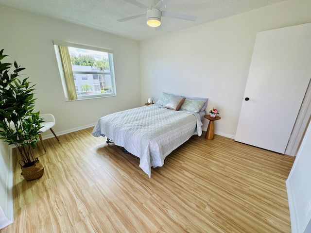 230 Normandy Ln E, Delray Beach, FL 33484 - bedroom featuring light wood finished floors, baseboards, and ceiling fan