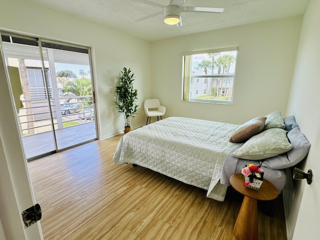 230 Normandy Ln E, Delray Beach, FL 33484 - bedroom featuring access to outside, light wood-type flooring, and ceiling fan