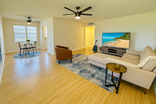 230 Normandy Ln E, Delray Beach, FL 33484 - living area with a ceiling fan, wood finished floors, and baseboards
