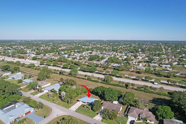 birds eye view of property with a residential view