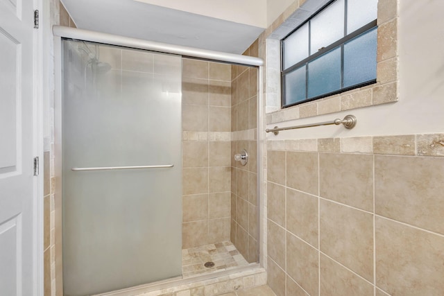 bathroom featuring a shower stall