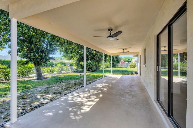 view of patio / terrace featuring ceiling fan and fence