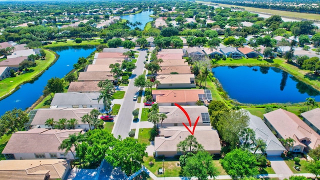 aerial view with a residential view and a water view