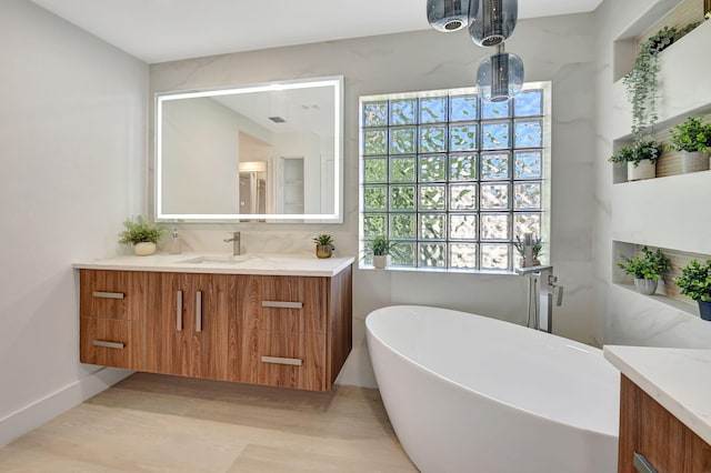 11287 Vivero Ave, Boynton Beach, FL 33437 - full bath with a soaking tub, vanity, and wood finished floors