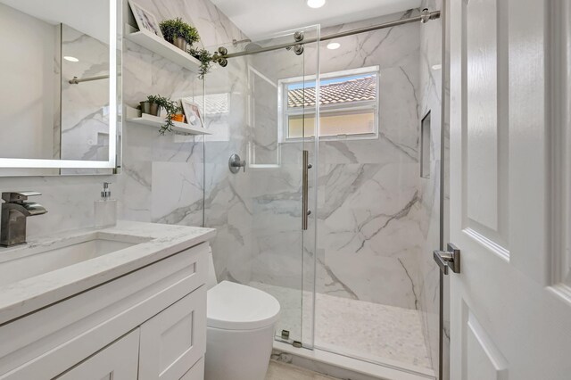 11287 Vivero Ave, Boynton Beach, FL 33437 - bathroom featuring a marble finish shower, toilet, and vanity