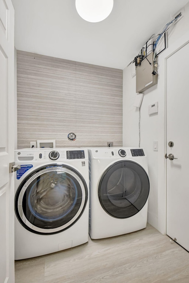 11287 Vivero Ave, Boynton Beach, FL 33437 - laundry area with separate washer and dryer, laundry area, and wood finished floors