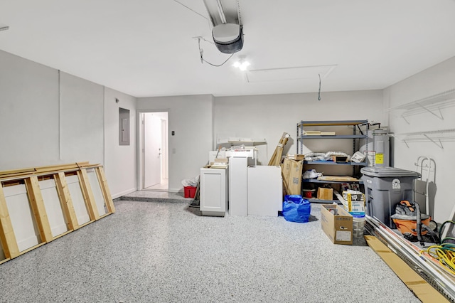 11287 Vivero Ave, Boynton Beach, FL 33437 - garage with a garage door opener, electric panel, and electric water heater