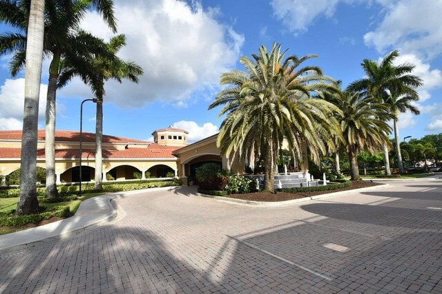 11287 Vivero Ave, Boynton Beach, FL 33437 - view of property with curved driveway
