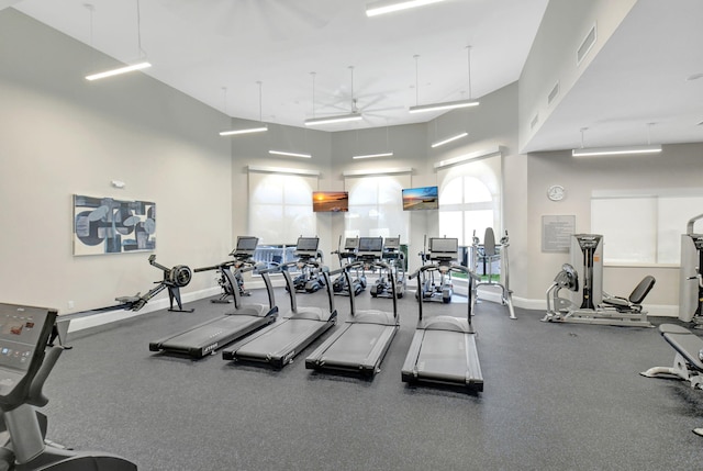 11287 Vivero Ave, Boynton Beach, FL 33437 - gym featuring a towering ceiling, visible vents, baseboards, and a ceiling fan