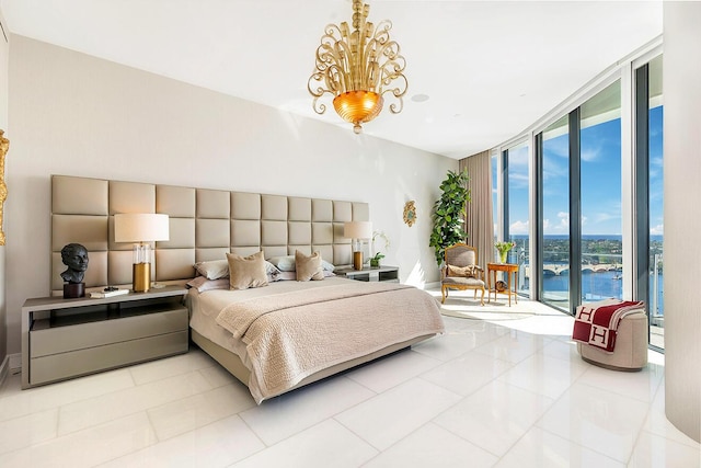 tiled bedroom featuring expansive windows, a notable chandelier, and access to exterior