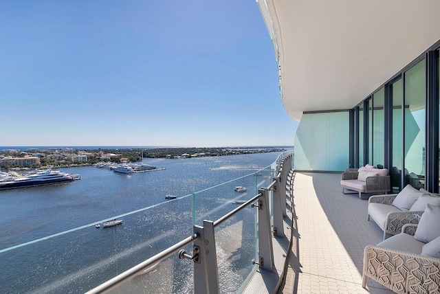 balcony featuring a water view