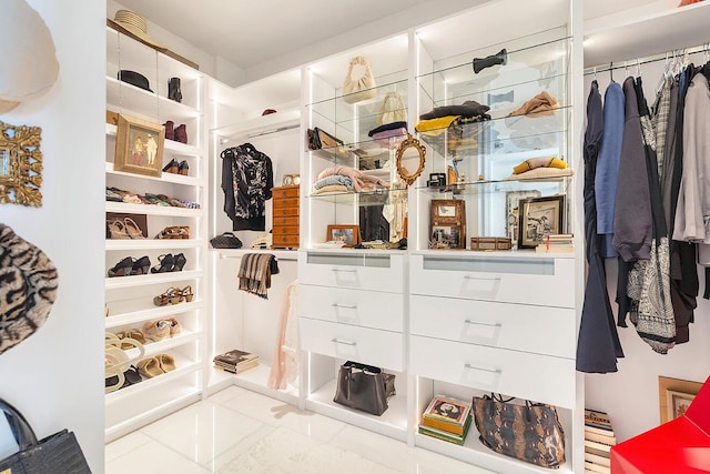 walk in closet with tile patterned floors