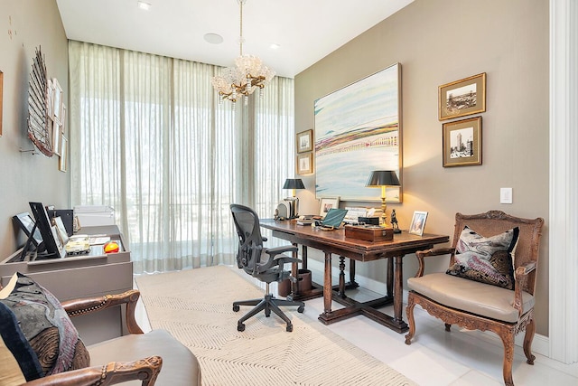 office area featuring baseboards and a chandelier