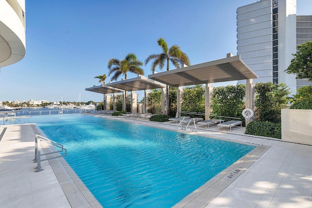 community pool with a patio area