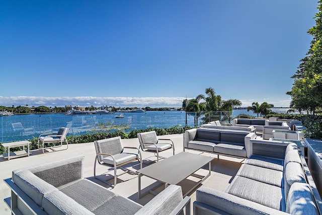 view of patio featuring an outdoor living space and a water view