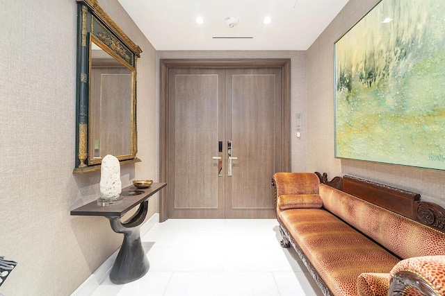 foyer entrance with tile patterned flooring and baseboards