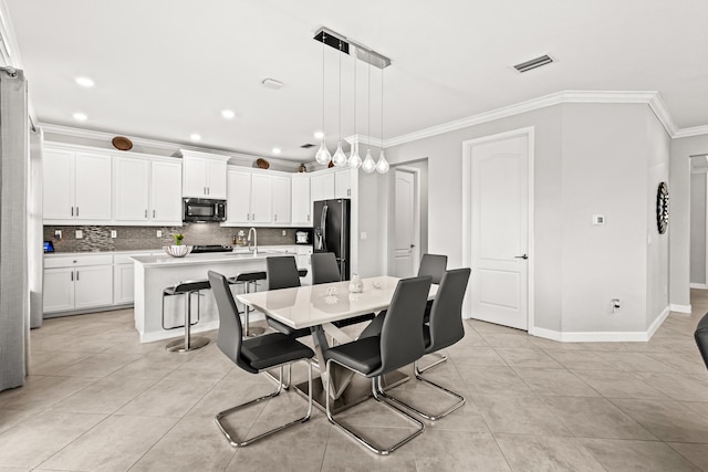 dining room featuring light tile patterned floors, visible vents, recessed lighting, and crown molding