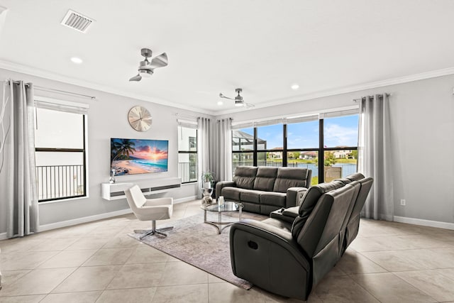 living room featuring light tile patterned floors, baseboards, visible vents, and ornamental molding