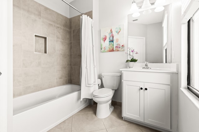 bathroom with vanity, baseboards, tile patterned flooring, shower / bath combination with curtain, and toilet