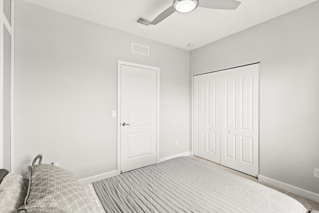 bedroom featuring visible vents, baseboards, a closet, and ceiling fan