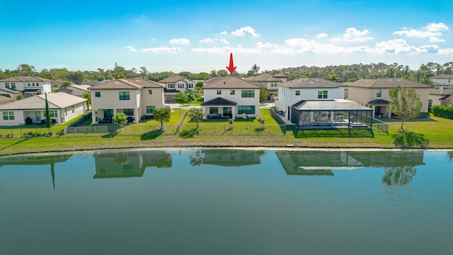 bird's eye view featuring a residential view and a water view