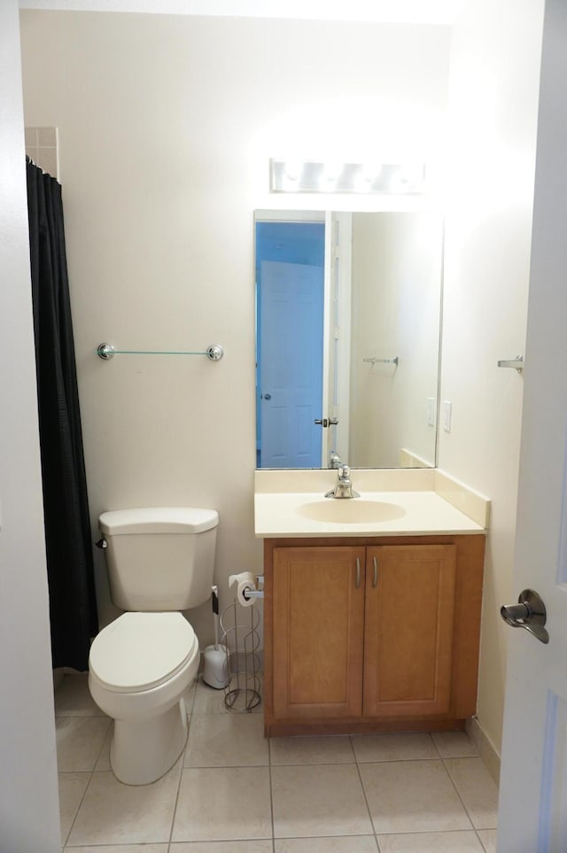 full bathroom with tile patterned flooring, toilet, and vanity