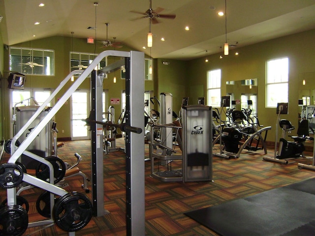 gym with recessed lighting, carpet, ceiling fan, and vaulted ceiling