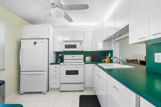 kitchen featuring light tile patterned floors, white cabinets, white appliances, a ceiling fan, and a sink