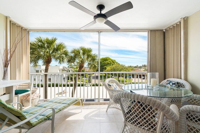 sunroom featuring ceiling fan